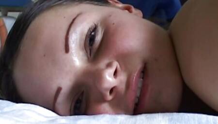 German teenager gets her ass oiled in a cam show and fingered by a horny milf! Presented by EroticOnly