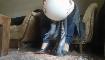 A BIG STURDY BALLOON UNDER MY POWERFUL HEELS