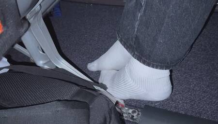 Amelie candidly filmed removing her sneakers onboard busy aircraft
