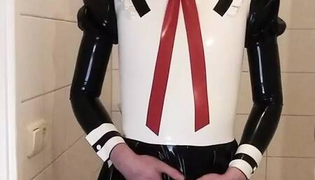 Latex maid uniform dress with black rubber skirt, red bow, frilly stockings and mask