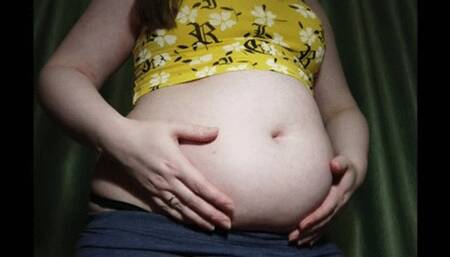 Fatty girl plays with big soft belly in tight top and leggings