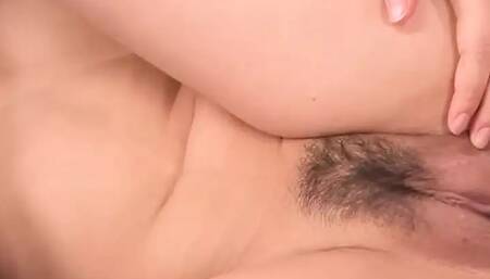 Kokone Mizutani, a nude Asian woman, lets a stud plow her on the couch. Super super-hot JAV action!