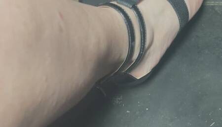 Driving in black strappy wedge sandles with black nail polish