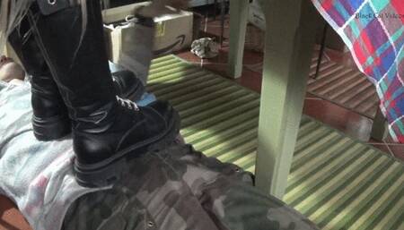 footstool under combat boots