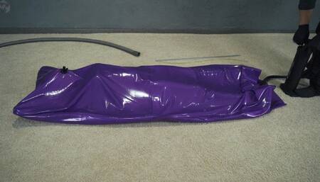 Purple vacuum bed with inflatable mattress and inflatable pear gag