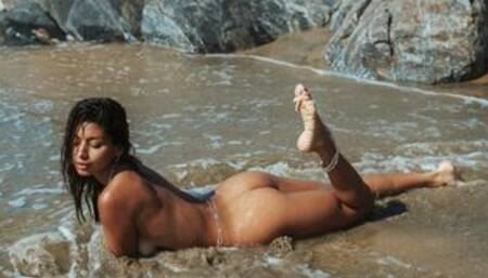 Petite Mexican babe strips at the beach