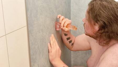 amateur sucks dildo in the shower