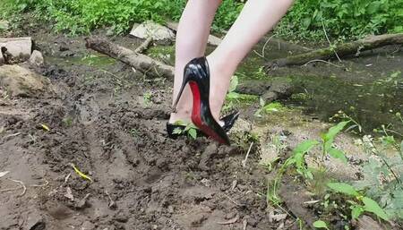 Christian Louboutin in swamp, high heels louboutin in deep mud, wrecked louboutin, messy high heels