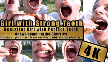 4K - Beautiful Girl shows her perfect teeth and bites, chews, squashes with her Strong Teeth very close to the camera Haribo Happy Cherries