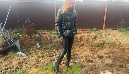 The girl wanted to get her new leather boots dirty, but she accidentally got stuck in knee-deep mud and couldn't get out