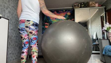 Valeri play and ride on big gray yogaball