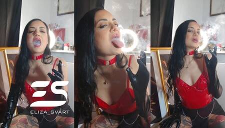 Smoking in a red pvc bodysuit and leather gloves
