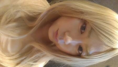 A blonde cross-dressing boy masturbated in a swimsuit
