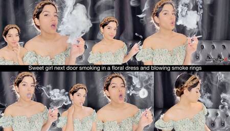 Sweet girl next door smoking in a floral dress and blowing smoke rings