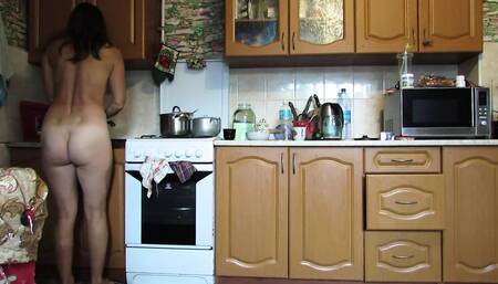 Naked hostess in the kitchen