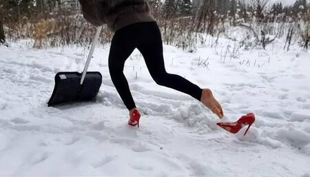 cleans snow with a shovel in louboutin, louboutin hot chick in winter forest, high heels in snow