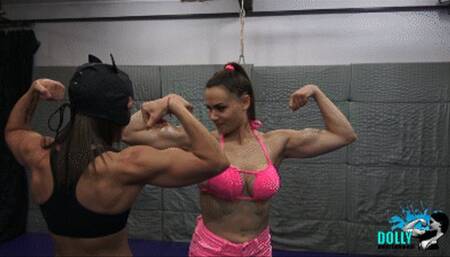 Dolly lift and carries Kim, muscular ladies flexing together