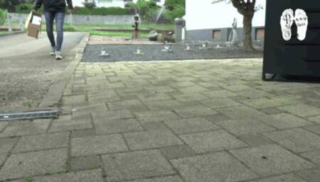 Cardboard boxes crushed under Sneakers