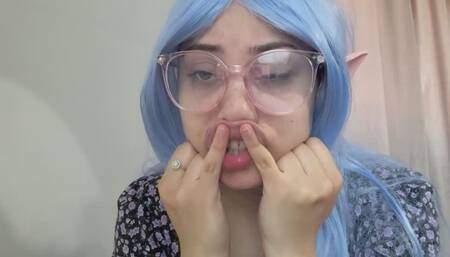 anime cosplayer elf girl ahageo making faces with pacifier and sucking her finger