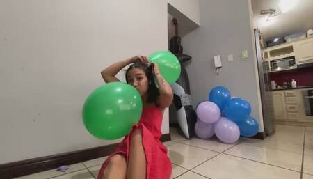 Akina hangs balloons on her head