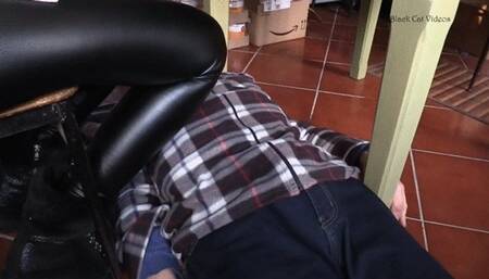 footstool under studded boots