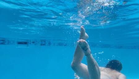 Carissa swimming and fighting with the body stocking underwater