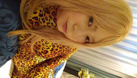 A cross-dressing boy masturbated in leopard print full-body tights, wearing long gloves and knee socks.