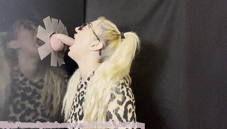 A blonde girl with a ponytail and glasses and her gloryhole