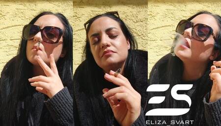 Smoking a Marlboro red in the sun and chewing a gum