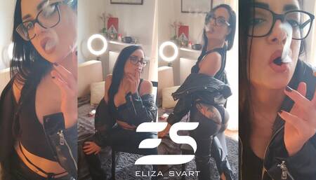 Smoking in a full leather outfit, braided ponytail and glasses