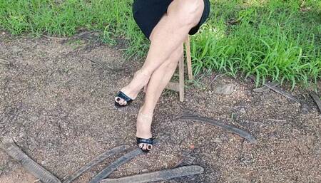 Mature woman with big crossed legs and high heels (1)