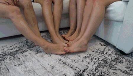 4 gerls crossed legs and interlocking their toes together TW
