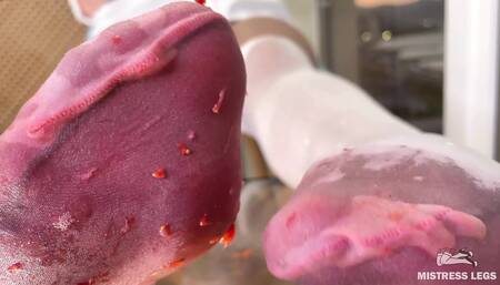 My Nylon Feet Squeezing Strawberry Juice on a Glass Table