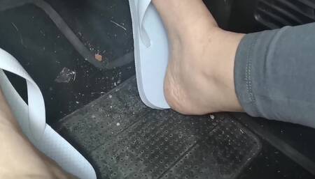 Sweaty Feet in Really Tasty Flip Flops Pedal Pumping on the Pedals of the Car