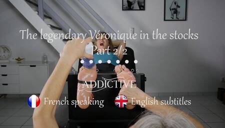 The legendary Veronique of "French Tickling" tickled in the stocks Part 2 ( French speaking with English subtitles )