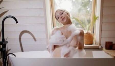Blonde teen displays soapy naked figure
