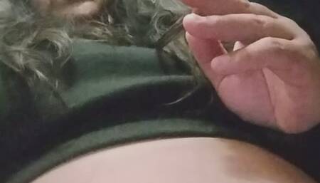 Smoking wearing a dark sensual outfit