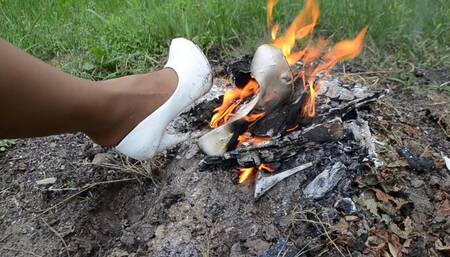 Wet muddy wrecked high heels, high heels in fire, lost shoe and dirty feet, ruined high heels, wedding high heels in fire, high heels destruction, high heels ruined in mud