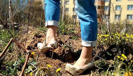 Wet and muddy high heels, high heels stuck in grass, wrecked shoes
