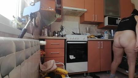 Sexy mom makes breakfast, hairy pussy, big tits. Sexy woman clears out the house, hairy, big ass.