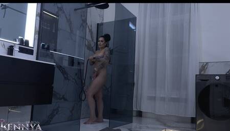 Watch Mistress Kennya take a shower while you are in chastity