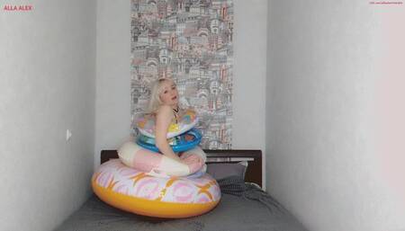 Alla wears five inflatable rings and releases air from them by opening the valves