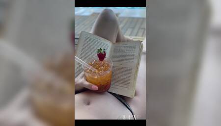 Reading by the Pool in a Bikini That Barely Counts as Spf