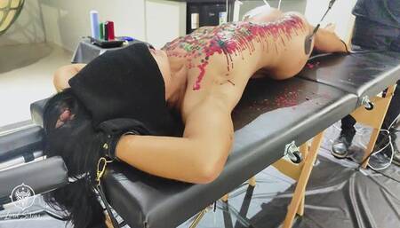 BDSM slave punished with spanking and wax play