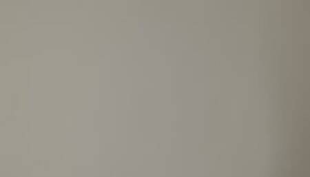 NILLY STANDS IN FRONT OF THE CAMERA AND BLOWS OUT ROUND SMOKE