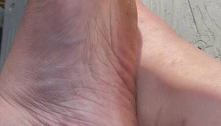 Foot Flexing With Green Toe Nails Outside