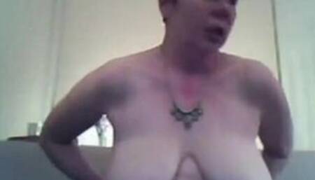 Busty mature brunette shows off her big natural saggy tits on webcam