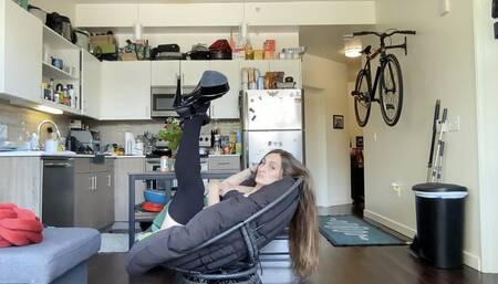 Effigy finger combs her long hair and fans it over the chair.