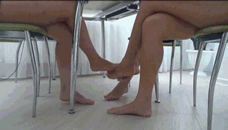 Footsie barefoot of 3 pairs beautiful legs under table Fs