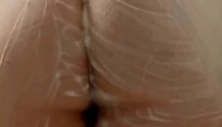 Taking a shower with foamy shower gel